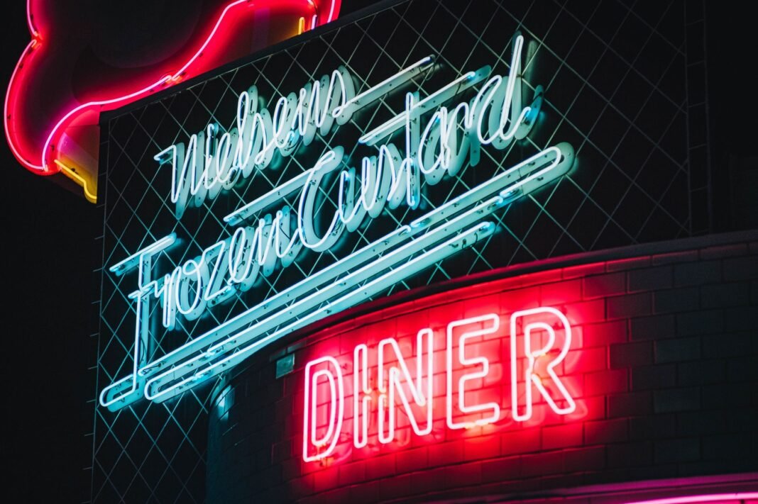 Late night food Brooklyn — neon-lit diner sign glowing after midnight