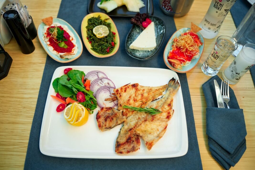Best Greek food in Astoria - whole grilled fish and mezze spread