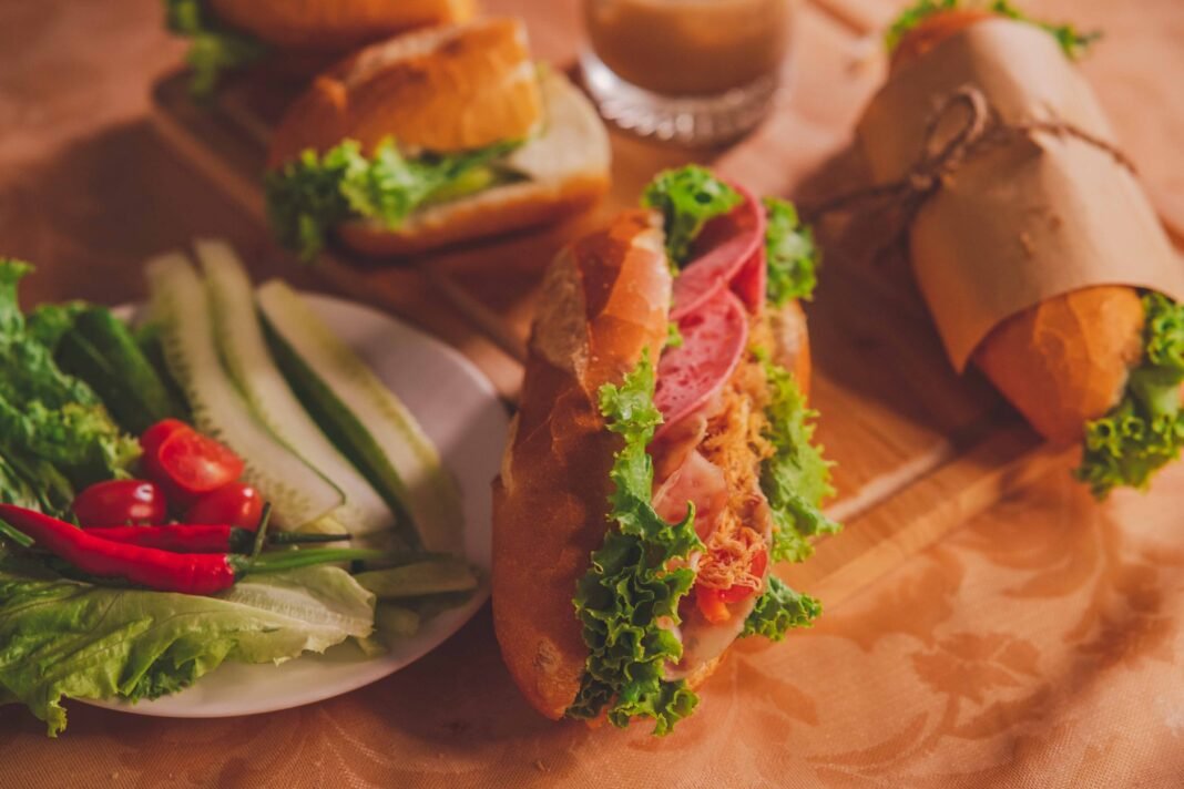 Best banh mi NYC - close-up of a Vietnamese banh mi sandwich with fresh herbs and pickled vegetables