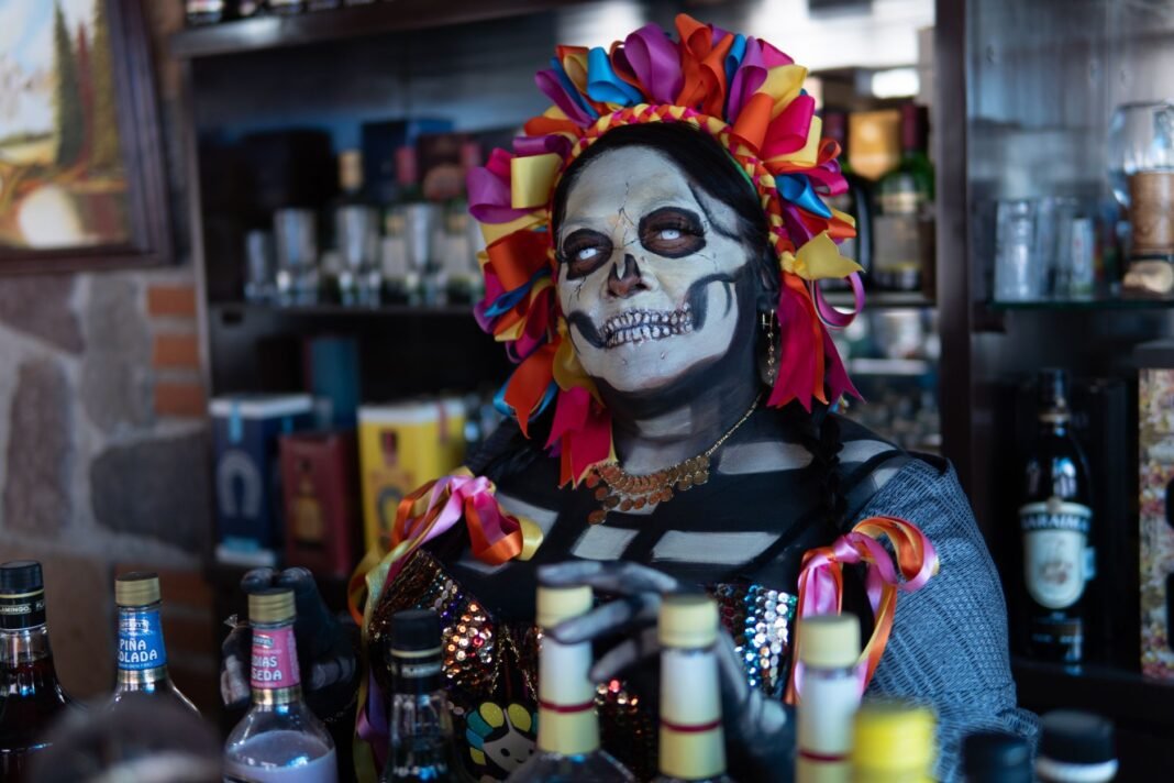 Halloween events NYC for adults: Catrina makeup at a costume night in a bar