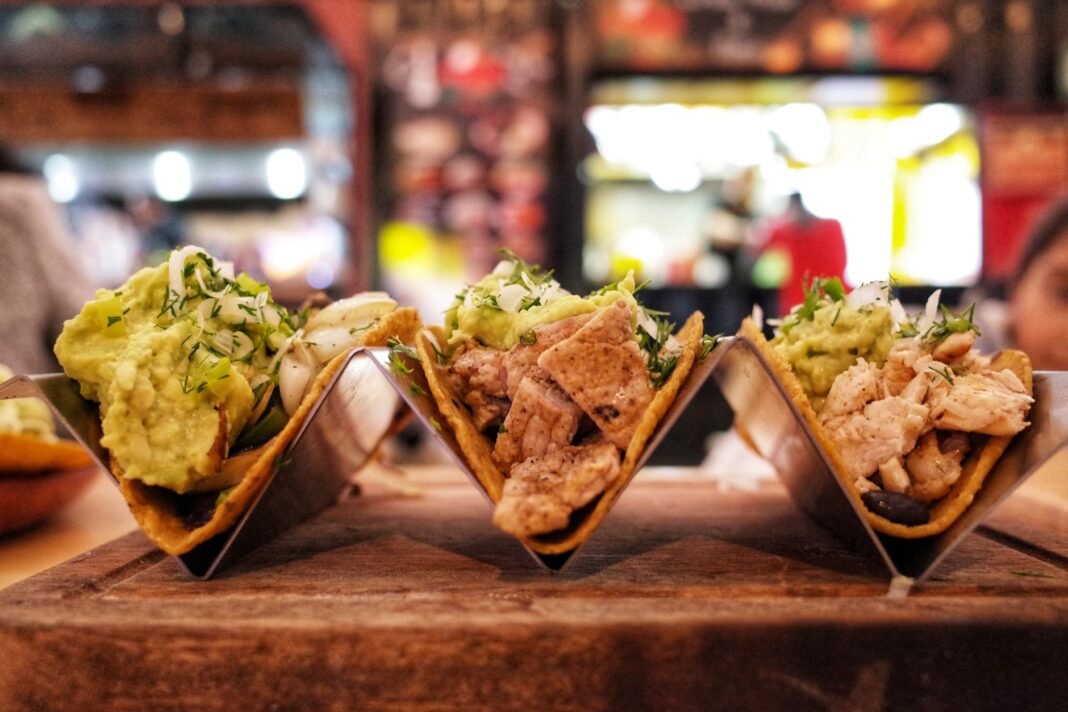 Best tacos NYC restaurants - three chicken tacos with guacamole and herbs