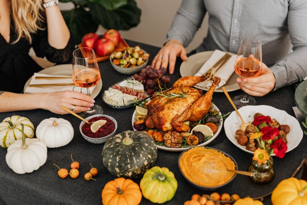Best thanksgiving restaurants NYC - a Thanksgiving dinner table with turkey and wine